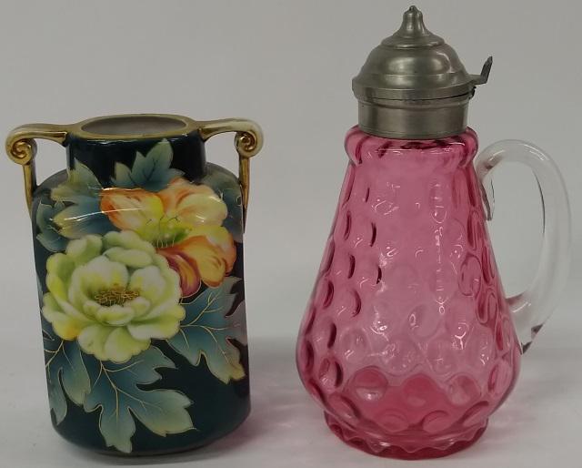 *2 PIECES: Victorian cranberry glass syrup with pewter lid and clear handle, approximate height 7 3/8", and a Nippon 2-handled vase having floral decoration, approximate height 5 5/8".