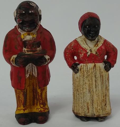 *PAIR OF CAST IRON FIGURES: Mammy and Uncle Ben.