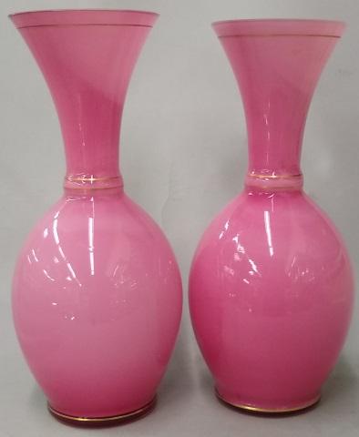 PAIR OF PINK GLASS VASES: With cream interior, approximate height 13 1/4".