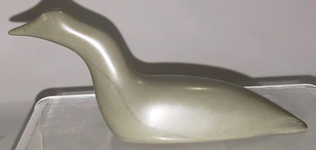 *INUIT CARVED STONE SCULPTURE: Bird, marked "Eskimo Art, Belcher Islands", approximate length 6".