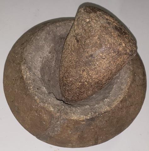 *NATIVE AMERICAN STONE MORTAR AND PESTLE: Widest diameter approximately 7 1/2".