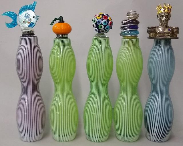 5 ART GLASS BOTTLES: 3 green, 1 purple, and 1 blue, with different stoppers, tallest is 9 3/4".