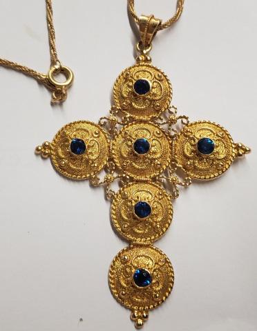 *18K YELLOW GOLD CROSS AND CHAIN: Byzantine style, cross is set with small synthetic sapphires, cross and chain stamped 750, approximate total weight 13.9DWT.