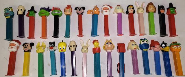 *GROUP OF PEZ DISPENSERS: Group of Pez candy dispensers.