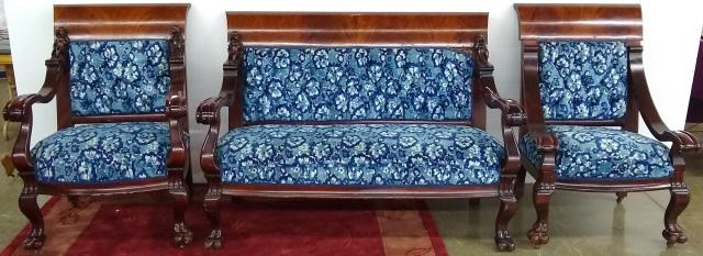 *3-PIECE LATE VICTORIAN MAHOGANY PARLOR SET: Having settee armrests surmounted with cherubs trailing down to scroll arms and raised on lion paw feet, and 2 armchairs.