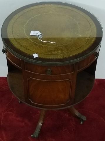 DRUM TABLE: Having inset leather top fitted with 2 drawers and shelf below, sabre legs fitted brass lion paw caps.
