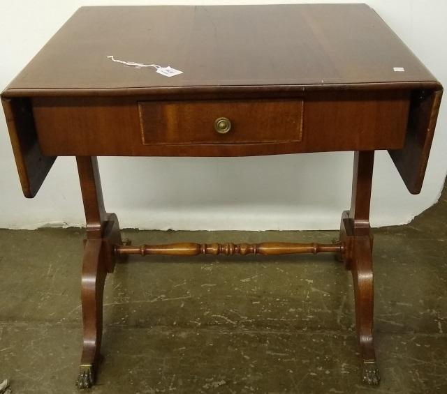 19TH C. MAHOGANY WRITING TABLE: Having drop leaves centered by single drawers, raised on trestle base.