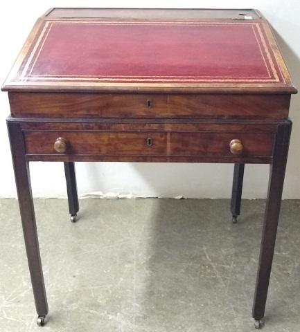 *19TH C. SCHOOLMASTER'S DESK: Having hinged top with inset leather opening to fitted interior with cubby holes, drawers, and single apron drawer, raised on square tapering legs, approximate height 35", width 28 1/2", depth 23".