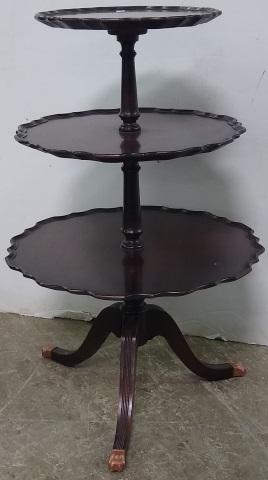 GEORGIAN STYLE MAHOGANY 3-TIERED TABLE: Having ruffled border, raised on tripod base, ending with lion paw feet.