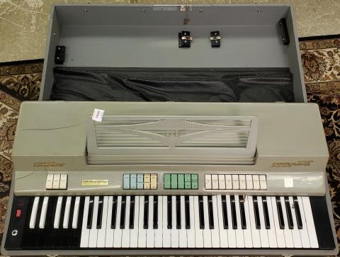 COMBO COMPACT ELECTRONIC ORGAN: Complete with case.