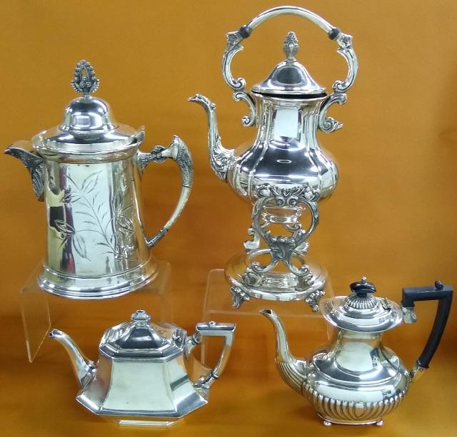 4 PIECES OF SILVERPLATE: Coffee server on pouring stand, coffee kettle, and 2 teapots.