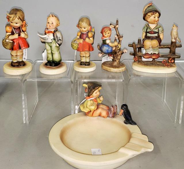 6 HUMMEL FIGURINES: "Schoolgirl" 81/0, "The Soloist" 135, "Apple Tree Girl" 141 3/0, "Schoolgirl" 81 2/0, "Wayside Harmony" 111/1, and "Singing Lesson" ash receiver 34.
