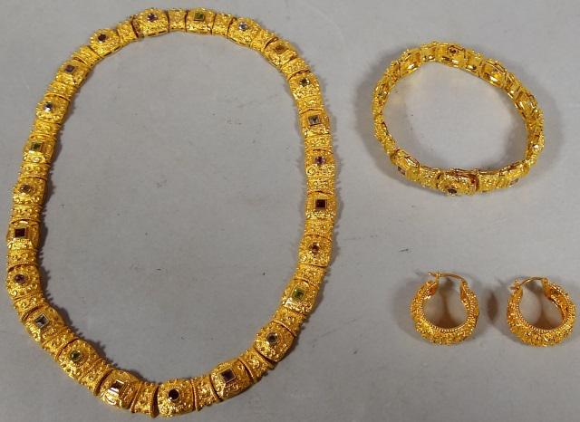 *TECHNIBORD SET OF JEWELRY: Necklace, bracelet, pair of earrings, all with gold finish, and multiple stones.