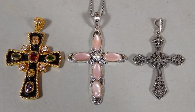 *3 STERLING SILVER CRUCIFIXES: 1 inset with multi colored semi-precious stones, 1 with mother of pearl, and 1 with pierced decoration, approximate weight, 1.25 troy ounces.