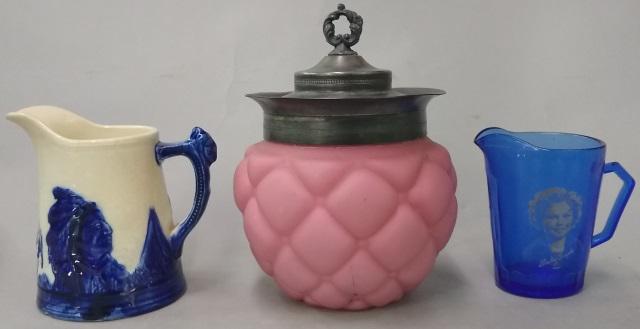 3 PIECES: Victorian pink satin glass biscuit barrel with silverplate lid, approximate height 7 1/2", sleepy-eye pitcher, height 5", and Shirley Temple cobalt glass creamer, height 4 1/2".