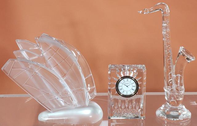 3 PIECES: Lalique sailboat, made by Mariscal for Lalique, engraved "Valencia 32nd America's Cup", approximate height 7 1/2", Waterford saxophone, 9 1/2" and Waterford boudoir clock 4 1/4".