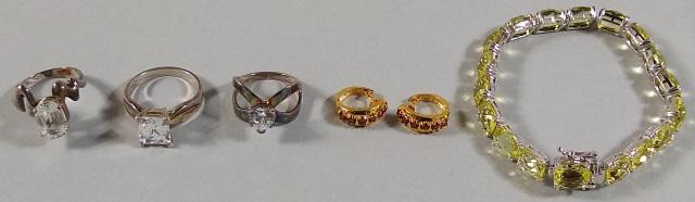 *7 PIECES OF STERLING SILVER JEWELRY: Pair of child's earrings, bracelet with light yellow stones, and 3 rings with faux diamonds.