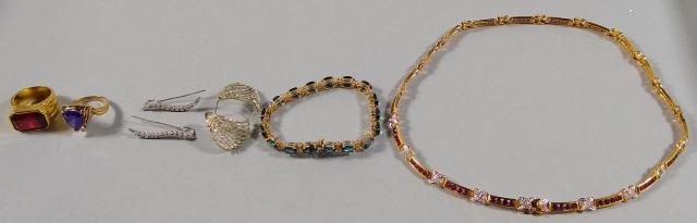 *8 PIECES OF STERLING SILVER JEWELRY: Bracelet with blue topaz, pair of earrings, ring with amethyst stone, pair of earrings, necklace with faux rubies, and ring with large faux ruby.