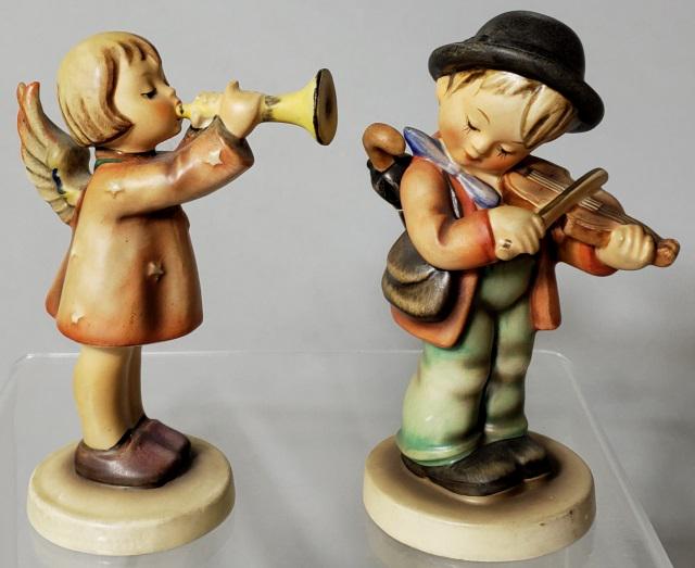 2 HUMMEL FIGURINES: Boy with violin and umbrella, No. 4, and angel with horn, No. 32/0.
