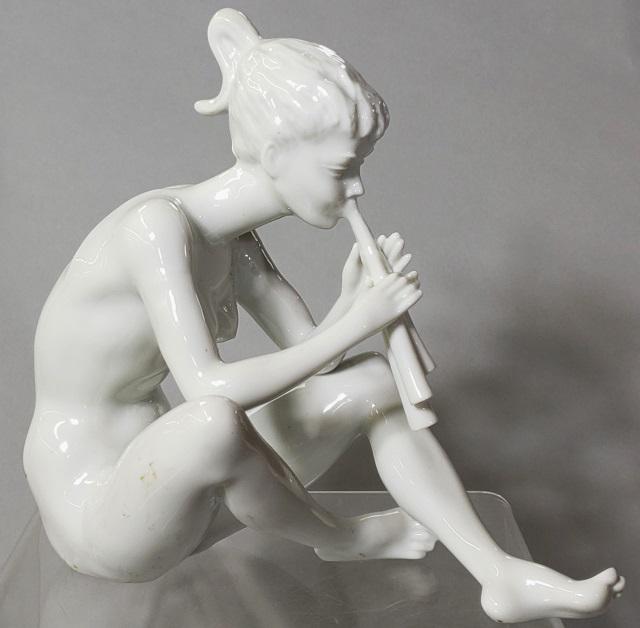 *KAISER PORCELAIN FIGURE: Depicting seated nude female playing flute, approximate height 7 1/4".