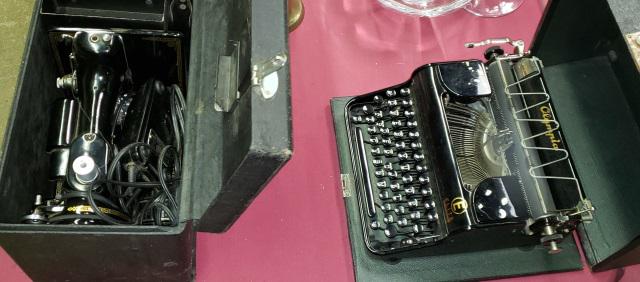 *2 PIECES: Portable Singer sewing machine and an Olympia Elite portable typewriter, both in fitted cases.