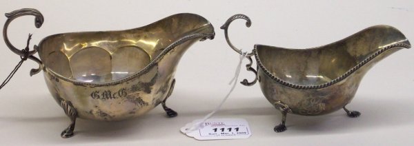 TWO STERLING SILVER CREAMERS: One English bearing 1871 Birmingham hallmark, approximate height 3 1/2", the other marked "E.A. Brown 62" on underside, height 3", d weight 7 troy ounces .