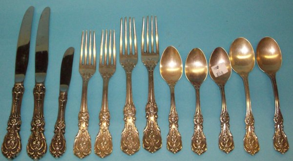 ***TWELVE PIECES OF REED AND BARTON STERLING SILV: "Francis I" pattern, comprising 3 teaspoons, 2 cereal spoons, 2 dinner forks, 2 luncheon forks, 2 hollow handled dinner knives, and 1 hollow handled butter knife.
