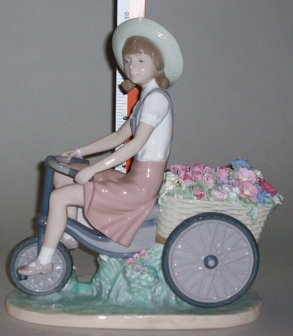***LLADRO PORCELAIN FIGURINE: "Girl With Flowers In Tow", #5031, issue year 1979, approximate height 10 1/4".