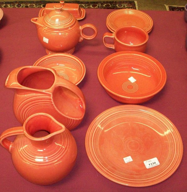 ***GROUP OF FIESTA DINNERWARE: Dinner plate, approximate diameter 10 1/2", two 7" bread plates, one 6 7/8" bowl, large 8 1/2" bowl, large coffee cup, height 3 1/2", 2 pitchers, height 7" and 7 3/4" , teapot, and butter dish.
