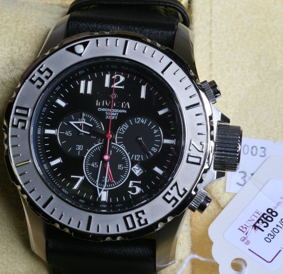 ***INVICTA DIVER CHRONOGRAPH WRISTWATCH: Stainless steel with black dial and black leather straps, complete with original presentation box and paper work.