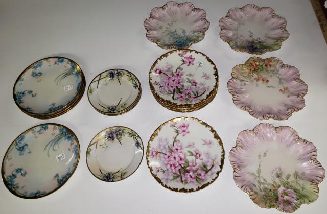 *20 HAND PAINTED PORCELAIN PLATES: 4 sets, set of 5 Limoges with pink flowers and gilt rims, set of 5 Czechoslovakian with blue flowers and gilt rims, set of 6 Nippon with purple flowers and 4 Limoges with 4 different flowers, Largest 