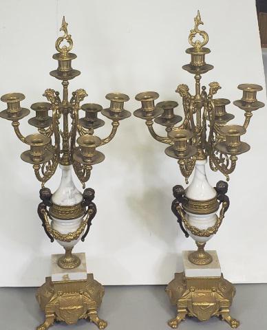 *PAIR OF CLASSICAL STYLE CANDELABRA: Alabaster and brass candelabra, each fitted with 7 branches, decorated with roosters and cherubic term figures, ending in lion paw feet, approximate height 27".