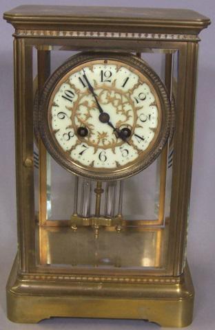 *FRENCH MANTEL CLOCK: Having enamel dial, with Arabic numeral markers, enclosed in brass case, works are marked made in France, stamped Medaille de bronze, L. Marti de Ce., with key and mercury pendulum, approximate height
