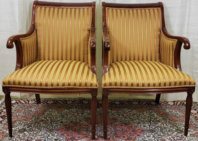 *PAIR OF REGENCY STYLE ARMCHAIRS: Having gold and red striped upholstery, scroll arms, and circular reeded legs, approximate height 38".