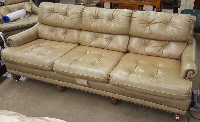 *BROWN LEATHER SOFA: Having tufted upholstery, approximate height 30", width 32", depth 82".