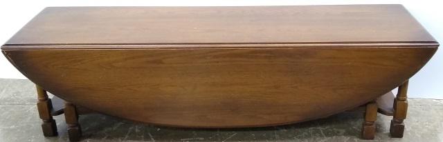 *OAK COFFEE TABLE: Having rectangular top and single drop leaf.