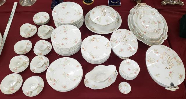 *SET OF PORCELAIN CHINA: Two different patterns, having floral decoration, 10 dinner plates, 11 salad plates, 4 soup bowls, 3 covered bowls, gravy with detached underplate, 4 graduated trays, 11 fruit bowls, 4 saucers, large 