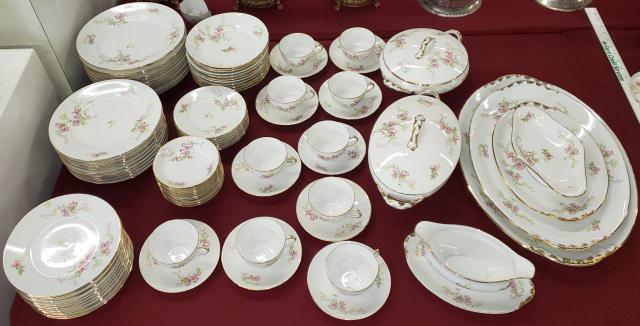 *SET OF PORCELAIN CHINA: 11 dinner plates, 10 salad plates, 12 dessert plates, 11 soup bowls, 11 fruit bowls, 7 bread plates, gravy with attached underplate, 2 covered serving bowls, 4 graduated trays, 10 cups & saucers.