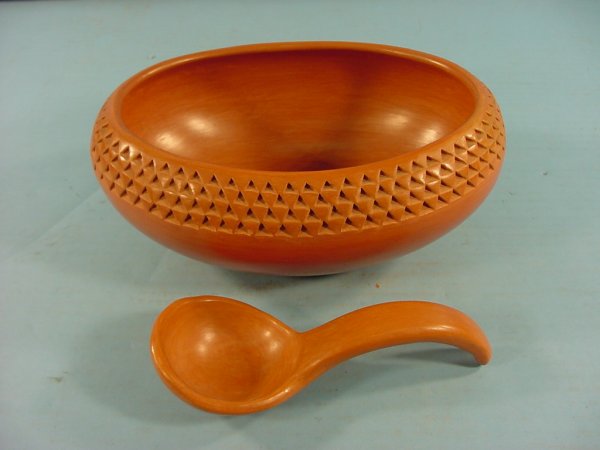 ***GARNET PAVATEA: Hopi redware pottery bowl having 4 rows of connecting triangular decoration, and ladle, both signed on bottom, approximate length 10", width 7 1/4", height 4".