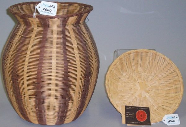 ***TWO CHEROKEE BASKETS: Lucy George, woven plaiting baskets with "U.S. Department of the Interior" tags, approximate diameter 10 1/2", height 12 1/4", and diameter 8 3/4", height 2".