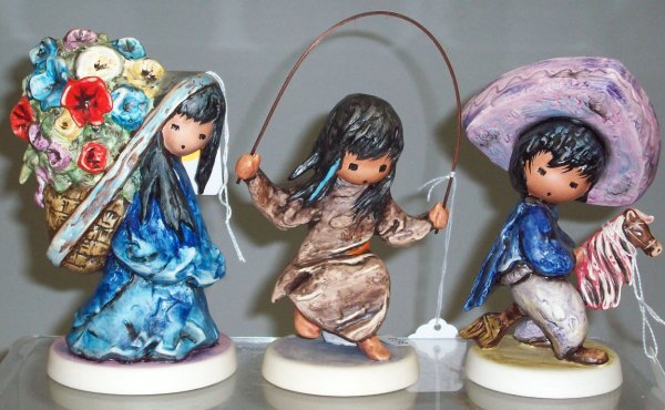 ***THREE GOEBEL DEGRAZIA FIGURES: "My First Horse" #10 312, approximate height 5 7/8", "Merrily, Merrily, Merrily" #10 330, height 6 1/2", and "Beautiful Burden" #10 328, height 6 1/4".