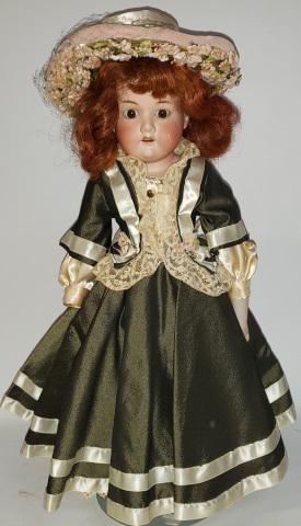 *ARMAND MARSEILLE BISQUE DOLL: Bisque shoulder head doll, having set eyes with open mouth and teeth, on leather hinged body with bisque arms, marked on back 370 A. M., approximate height 19".