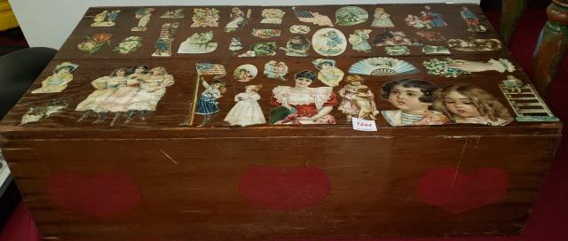 COVERED TRUNK: Top decorated with vintage die cuts, approximate height 11 1/8", width 36", depth 18 1/8".