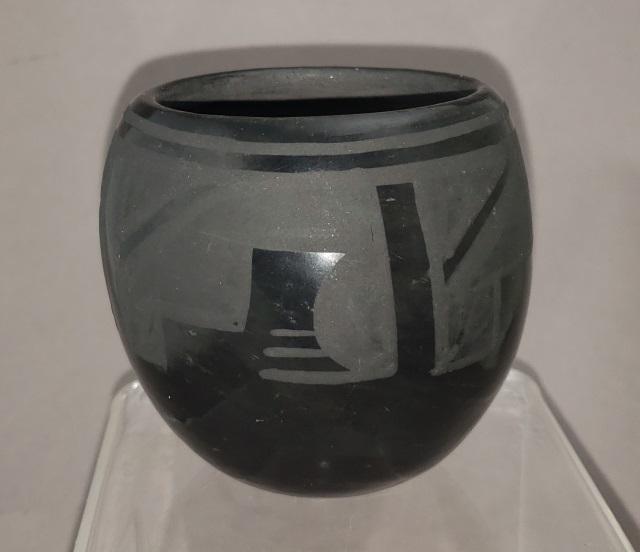 SANTA CLARA POTTERY JAR: Maria (Martinez), Santa Clara, black on black pottery jar, with geometric design, signed on bottom, approximate height 2 7/8", diameter 3".