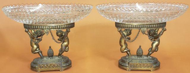 PAIR OF PERIOD STYLE CENTER BOWLS: Having cut glass oval bowl raised on silverplate stand, decorated with cherubs, marked pairpoint C1436, approximate height 6 3/4", width 9 1/4", depth 6".