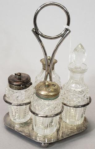 4 PIECE GLASS CONDIMENT SET: 4 piece glass condiment set with silverplate stand, approximate height 7 7/8".