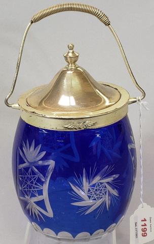 BLUE GLASS AND SILVERPLATE BISCUIT BARREL: Cobalt blue glass with etched design, and silverplate lid & handle, approximate height with handle 9 3/4".