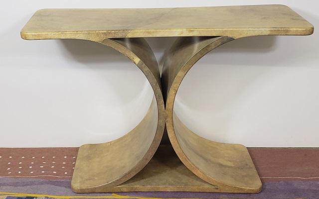 KARL SPRINGER CONSOLE TABLE: Karl Springer console table, original goatskin over wood, top & base connected by 2 curved supports, top is slightly concave, unmarked, approximate height 31 3/4", width 47 7/8", depth of ends 16 7/8"
