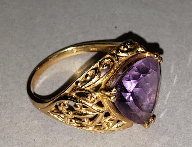14K GOLD RING: 14k yellow gold ring with triangular amethyst colored stone, approximate total weight 3.2 dwt., size 7 3/4.