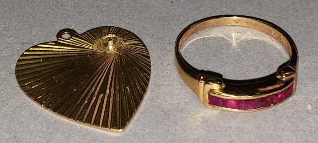 2 PIECES OF GOLD: A 14k yellow gold ring with ruby colored stones, size 6, and a 14k yellow gold heart shaped pendant, approximate height 7/8", approximate total weight 2.5 dwt.